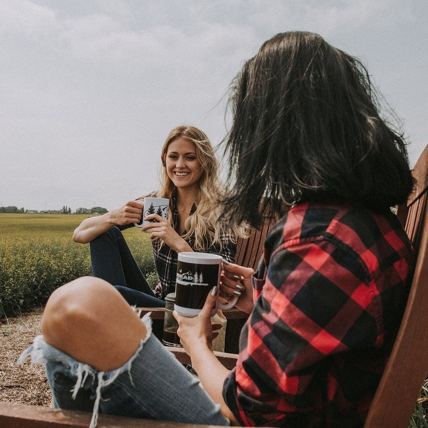 Socially distanced friends drinking coffee outside 