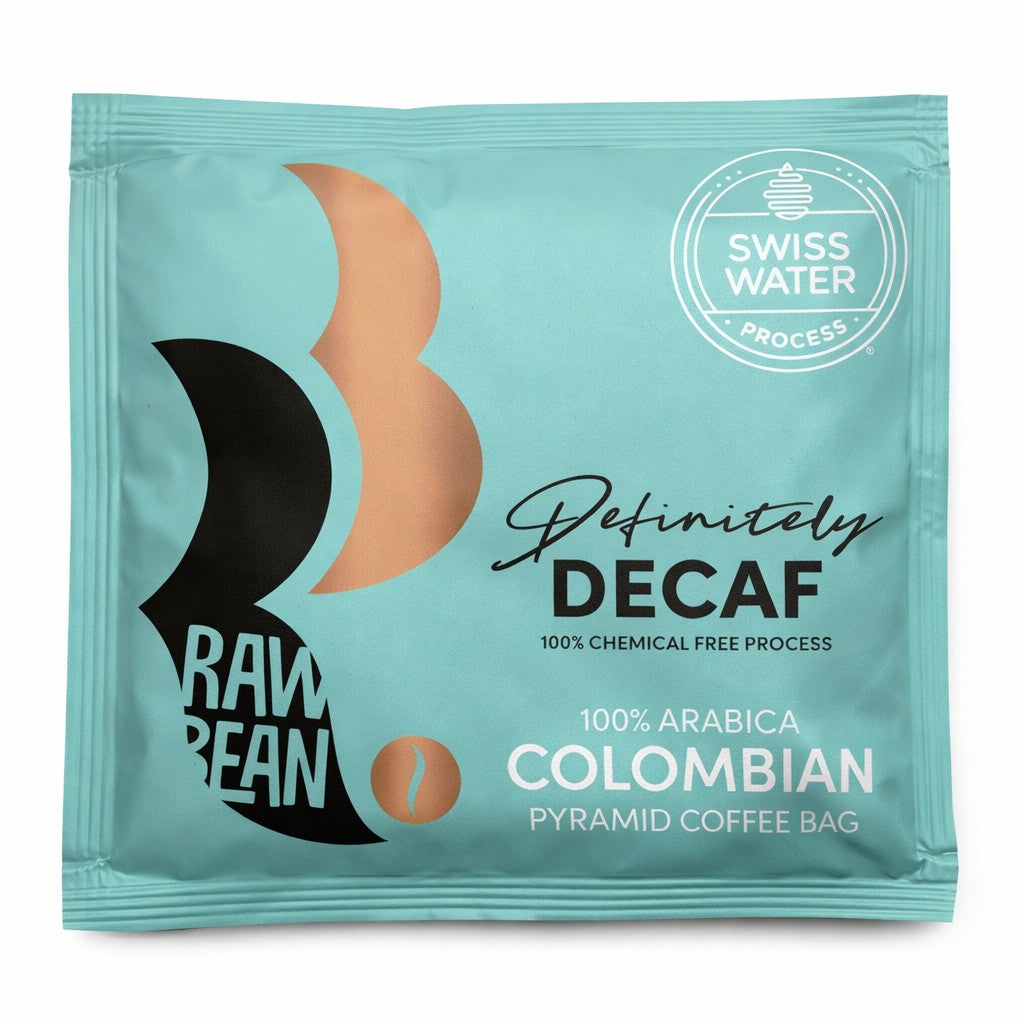 A square Raw Bean Definitely Decaf envelope in our newly updated  envelope design. The new duck egg blue envelope with a black and metallic steam logo and the Swiss Water Decaf badge, reading Definitely Decaf, Chemical Free Process, 100% Arabica Colombian pyramid coffee bag.