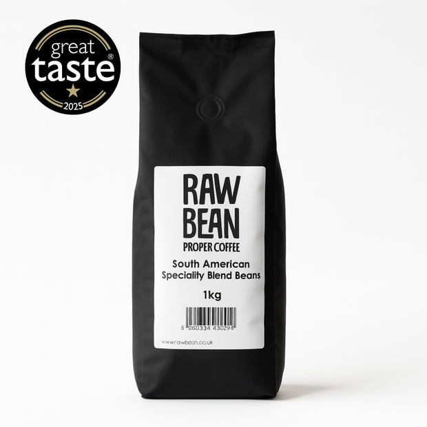 1 kg matt black bag of Raw Bean Proper Coffee South American Specialty Blend Beans with a 2025 Great Taste Award